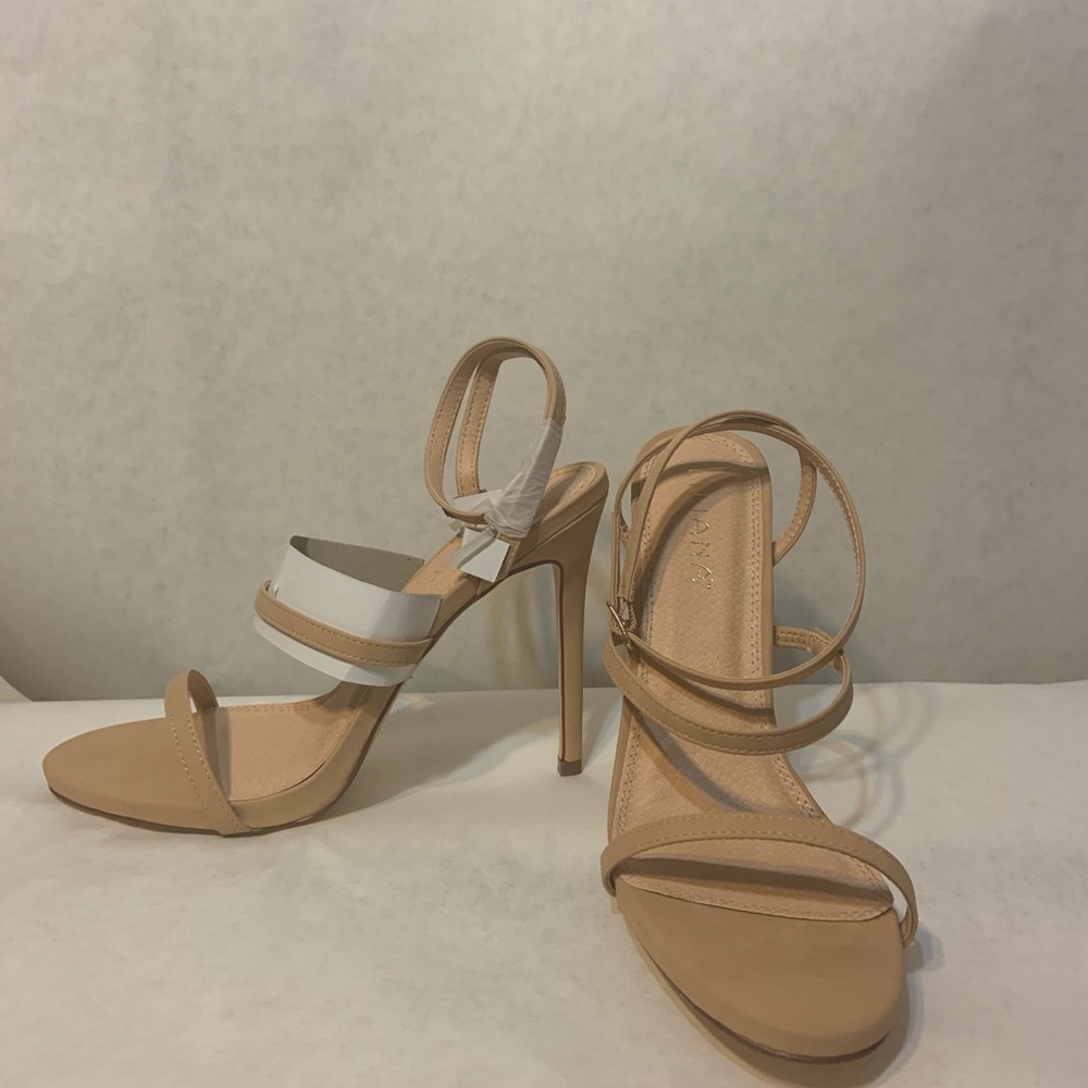 Stylish, nude, ankle strap, high heeled sandal.